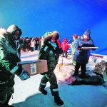 Representatives from many countries and universities arrive at the Svalbard Global Seed Vault in Longyearbyen, Norway, with new seeds in February 2020. The vault evokes epic imagery and controversy because of the symbolic value of seeds. | Reuters photo