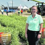 Holly Derksen, technical support specialist with UPL, was in front of display plots at the Ag in Motion farm show in Langham, Sask., earlier this year. | Don Norman photo