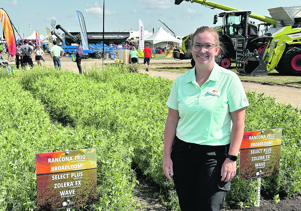 Holly Derksen, technical support specialist with UPL, was in front of display plots at the Ag in Motion farm show in Langham, Sask., earlier this year.  |  Don Norman photo