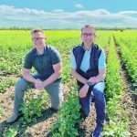 HyTech co-chief executive officer Cameron van Roon, left, and chief commercial officer Scott Horner check on the development of a hybrid canola seed crop near Lethbridge. | HyTech photo