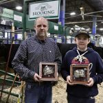 Justin and Kordell Morrison show off their recent Agribition hardware after taking home both the President's and First Lady's Classics.
