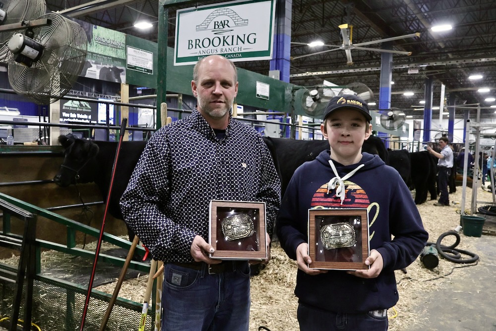Justin and Kordell Morrison show off their recent Agribition hardware after taking home both the President's and First Lady's Classics.