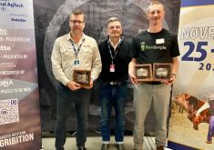 Katlin Lange, right, of Farm Simple, and Darren Wolchyn of Smart Paddock, are shown with Dave Belof, managing partner for Saskatchewan for Deloitte, a sponsor of the Animal Ag Tech Awards at Agribition. | John Greig photo