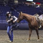 When Caitlyn Mastad became the first winner of the mounted cattle dog championships, her two-year-old border collie, Sage, couldn't help but leap into Mastad's arms after all the excitement. | Becky Zimmer photo