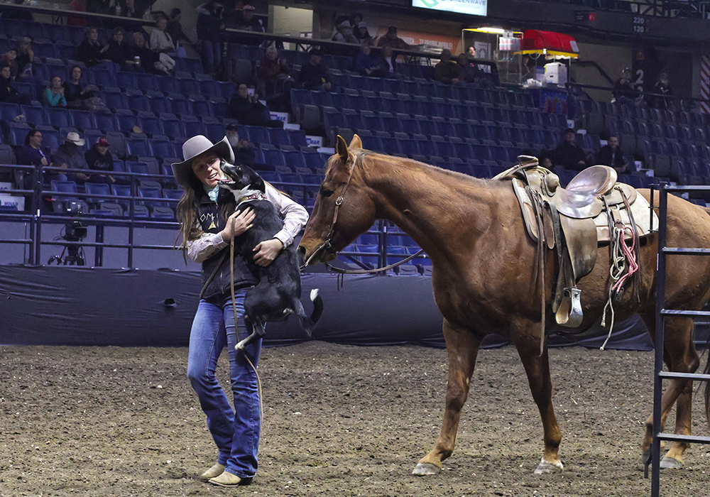 When Caitlyn Mastad became the first winner of the mounted cattle dog championships, her two-year-old border collie, Sage, couldn't help but leap into Mastad's arms after all the excitement. | Becky Zimmer photo