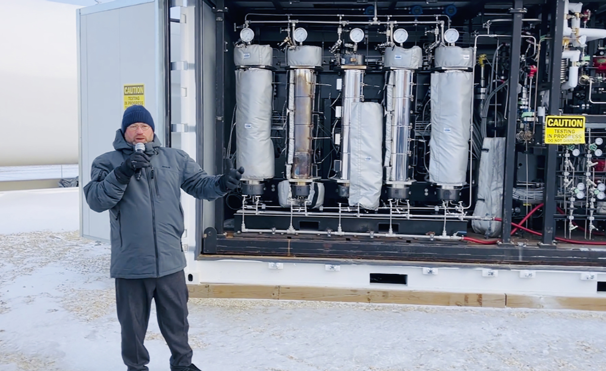 Ian Clifford with FuelPositive has been working with Curtis Hiebert of R & L Acres to install a modular setup on his farm that will supply it with on-farm produced green ammonia fertilizer. | Greg Berg photo