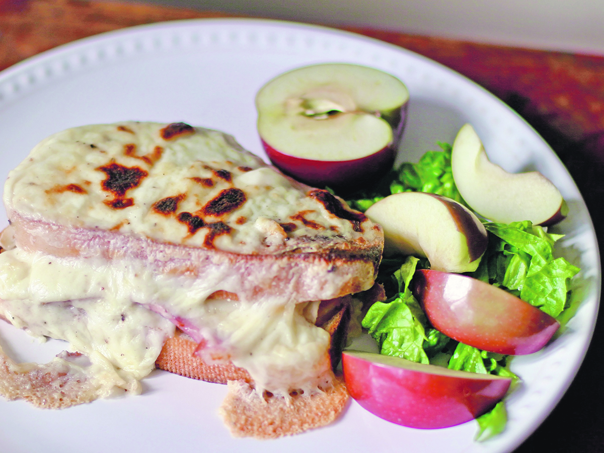 A Croque Monsieur is a fancy name for a grilled ham and cheese sandwich smothered in bechamel sauce and then browned under the broiler.  |  Sarah Galvin photo