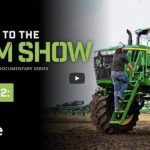 A YouTube screencap of the title screen of the second episode of the "Welcome to the Farm Show" documentary series showing the title, License to Drive, and two people climbing a ladder to get into a massive green tractor.