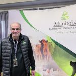 Gerry Friesen, chief administrative officer of the Manitoba Farmer Wellness Program, stands at the program’s booth at Ag Days in 2024.