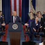 Donald Trump delivers his inauguration speech while outgoing president Joe Biden and vice-president Kamala Harris are seated to his left.