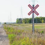 Photo of the railway crossing sign at an uncontrolled rail crossing in the country.