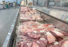 Packages of meat in a cooler at Costco.