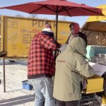 Rudy Wall of Cochrane Creek Farm selling hot dogs from his cart on the Lake Winnipeg ice on Jan. 19, 2025.