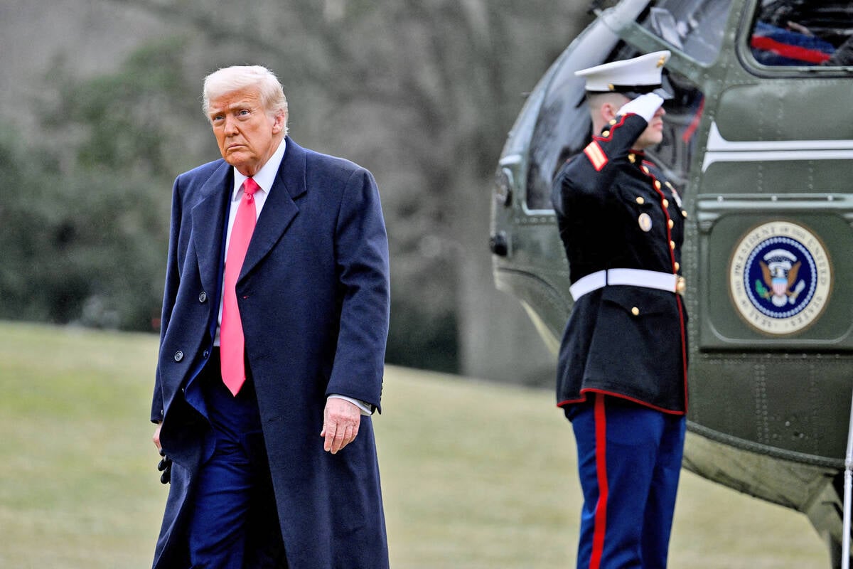 U.S. president Donald Trump leaves the Marine 1 helicopter on the south lawn of the White House.