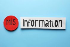 A stock image of a blue back ground with the word "information" written on a piece of white paper, and in front of it the prefix, "mis" written on a round red dot.