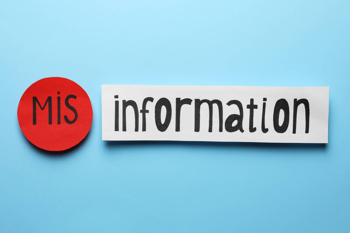 A stock image of a blue back ground with the word "information" written on a piece of white paper, and in front of it the prefix, "mis" written on a round red dot.