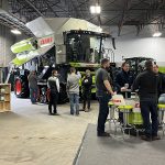 Visitors to Canada's Farm Show in Regina check out some of the new farm equipment on display.