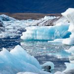 Jagged chunks of ice float in the water near Iceland.