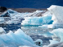 Jagged chunks of ice float in the water near Iceland.