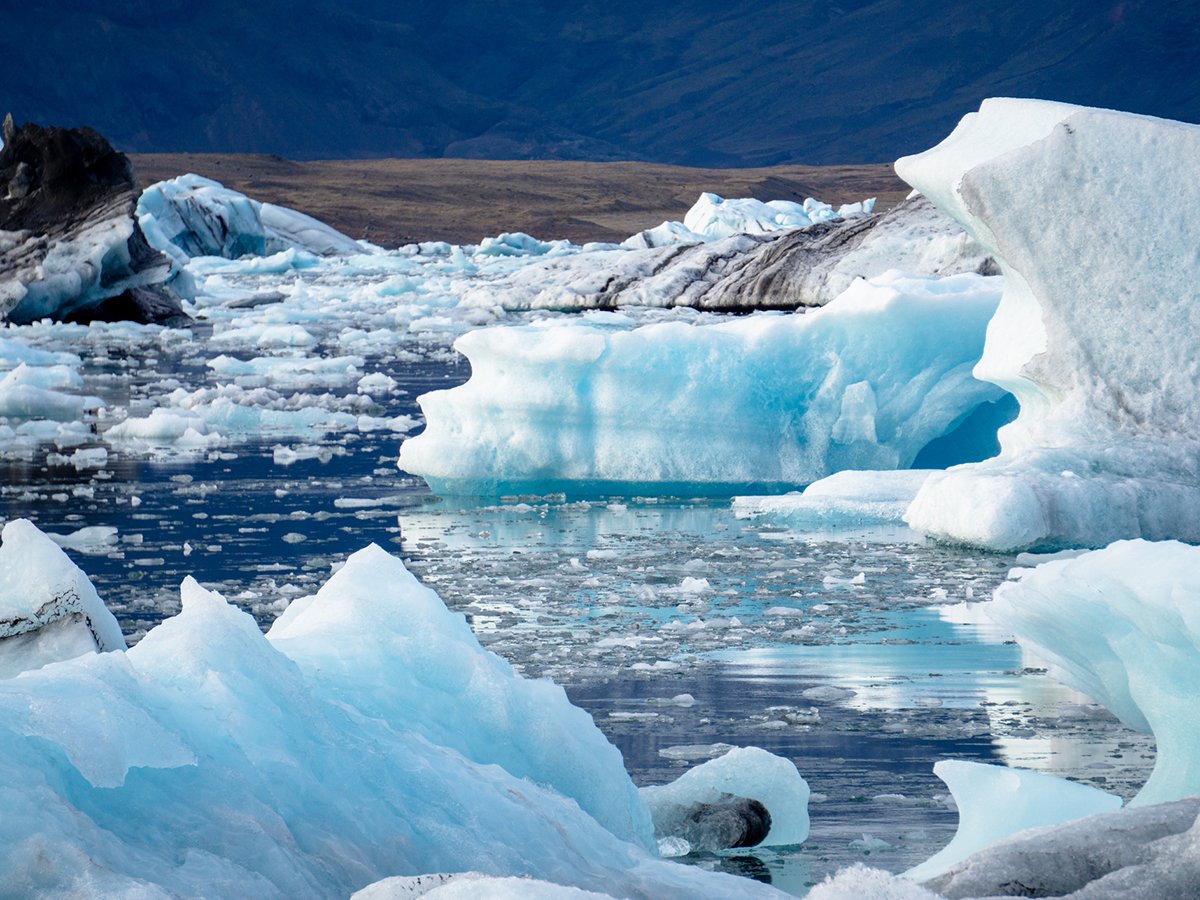 Jagged chunks of ice float in the water near Iceland.