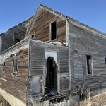 An abandoned farmhouse sits in a field southeast of Delisle, Sask.
