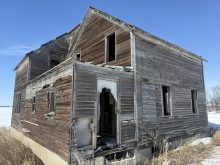 An abandoned farmhouse sits in a field southeast of Delisle, Sask.