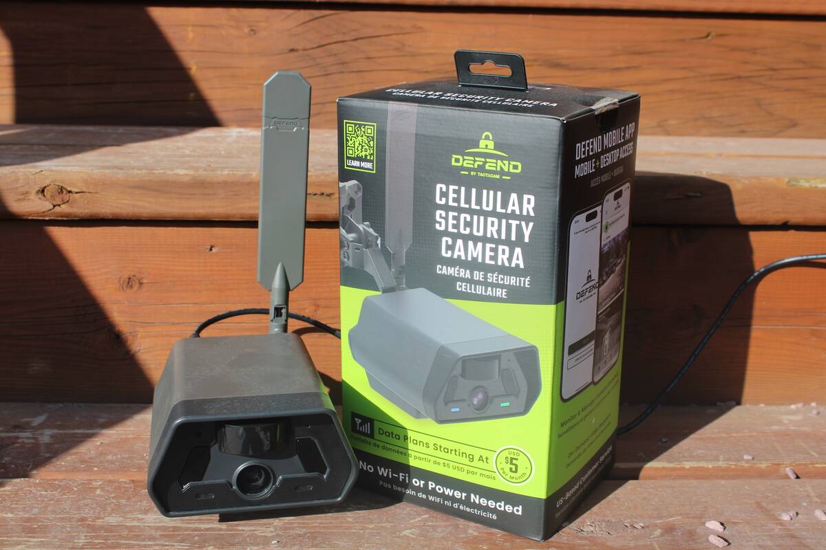 The new Defend camera system from Tactacam sits on a step next to the box it came in.