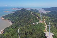 An aerial photo of wind turbines along a ridge in China.