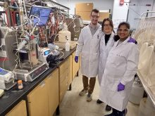 Mark Lawley (left), Filiz Hazal and Sapna Indrakumar, three of the post-doctorate students working on an animal feed project, pose for a photo in their lab.
