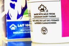 Close-up of a plastic container with "Made with milk from Canadian dairy farms" printed on it.