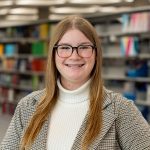 Brandon University chemistry student Kendal Giesbrecht poses for a photo in a library.