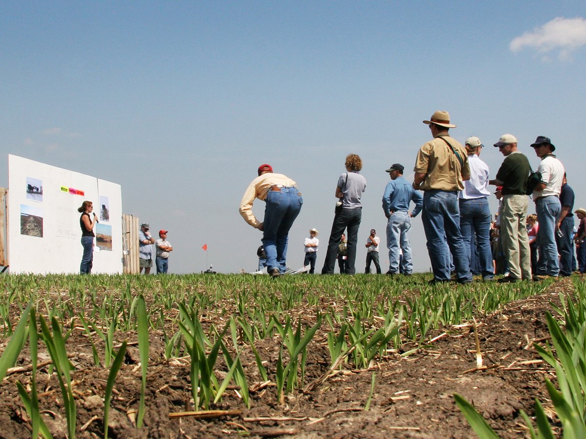 A low angle photo taken from ground level of the participants at the Western Beef Development Centre field day at the Termuende research farm near Lanigan, Saskatchewan.