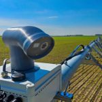 A multi-spectral sensor sits on each tower of the InteliRain variable rate irrigation system.