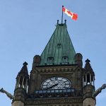 A Canadian flag flies at the top of the Peace Tower on Parliament Hill in Ottawa.