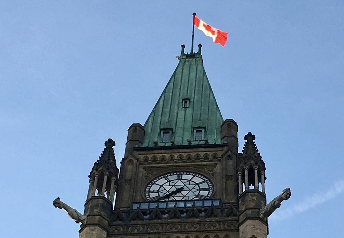 A Canadian flag flies at the top of the Peace Tower on Parliament Hill in Ottawa.
