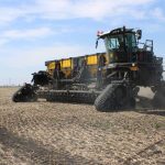 The Nexat implement carrier looks like a combine cab set overtop two tracks on one end and, in this configuration, with a seeding implement in the middle and two tracks on the far end.