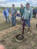 Photo by Greg Price
Dr. Henry Chau shows off a FieldScout TDR 350 to onlookers which measures volumetric water content, electrical conductivity and turf surface temperature. Chau's presentation, 'Tools for Measuring Soil Physical Health,' was part of Farming Smarter's field school in late June.