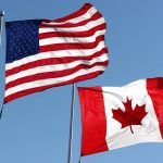 https://www.gettyimages.ca/detail/photo/flags-royalty-free-image/173870672?phrase=Canadian%20U.S.%20flags&adppopup=true
An American and Canadian flag waving in the wind. Photo: KKIDD/IStock/Getty Images