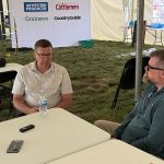 Scott Moe, left, talks to Western Producer reporter Sean Pratt at the Ag in Motion farm show near Langham, Saskatchewan.