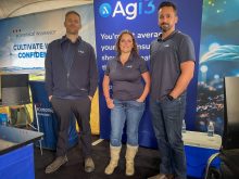(Left to Right) Kyle Gibson, Sharene Cunningham and Paul Munro stand at Agi3's booth at Agriculture in Motion on July 15, 2025.