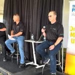 Left to right: Bruce Burnett, Jerry Klassen and Ranulf Glanville talk markets at the Ag in Motion farm show near Langham, Sask.