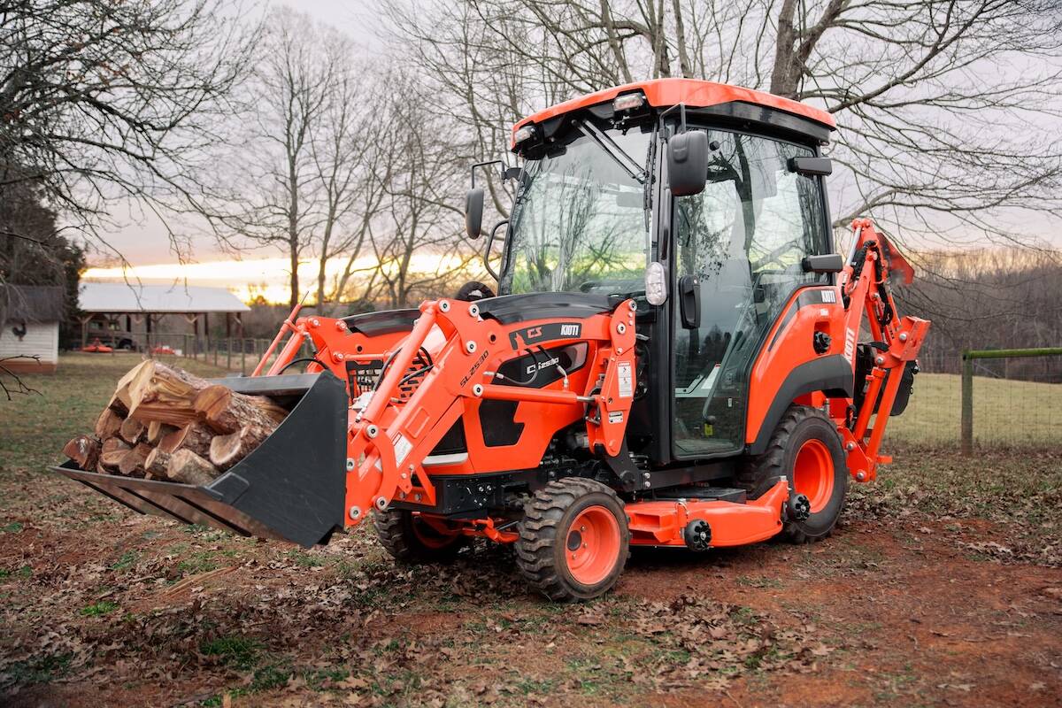 A promotional photo of the Kioti CS30 tractor showcasing its enclosed cab.