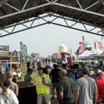 A crowd of people waiting to get onto the grounds of the Ag in Motion farm show near Langham, Sask.
