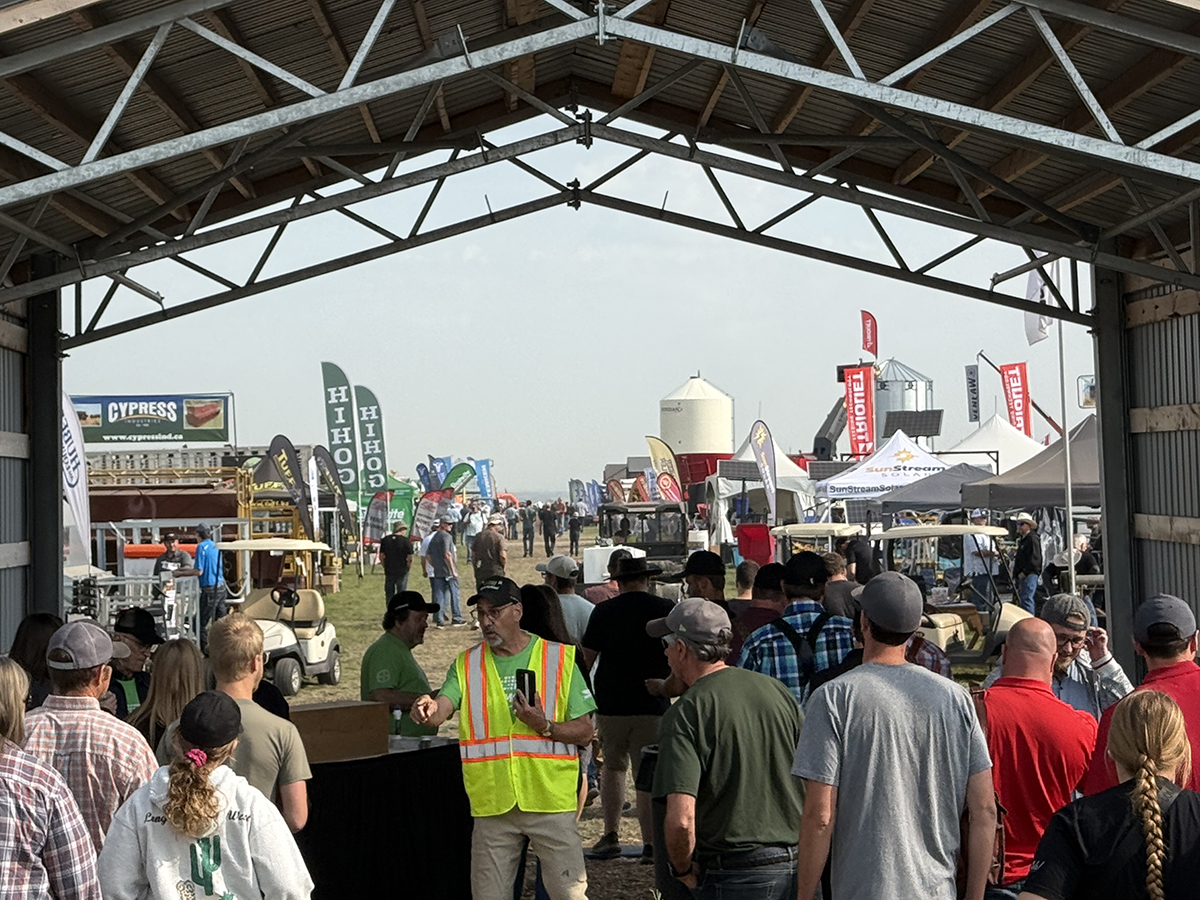 A crowd of people waiting to get onto the grounds of the Ag in Motion farm show near Langham, Sask.