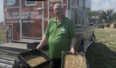 Dwayne Summach, livestock and feed extension specialist with the Saskatchewan Ministry of Agriculture, demonstrates how to use the Penn State Particle Size Separator at Ag in Motion 2025.
