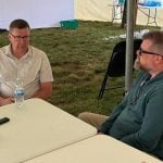 Scott Moe, left, talks to Western Producer reporter Sean Pratt at the Ag in Motion farm show near Langham, Saskatchewan. Photo: Paul Yanko