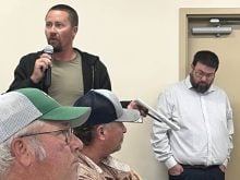 Photo by Greg Price
Chris Siemens (left), president of the Hays Grazing Association, pleaded there are other avenues to increased revenue streams for municpalities like property tax rates for farms relative to acreages as opposed to potentially selling off land leased by generational farmers to special interest groups.