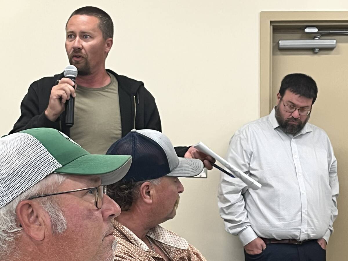 Photo by Greg Price
Chris Siemens (left), president of the Hays Grazing Association, pleaded there are other avenues to increased revenue streams for municpalities like property tax rates for farms relative to acreages as opposed to potentially selling off land leased by generational farmers to special interest groups.