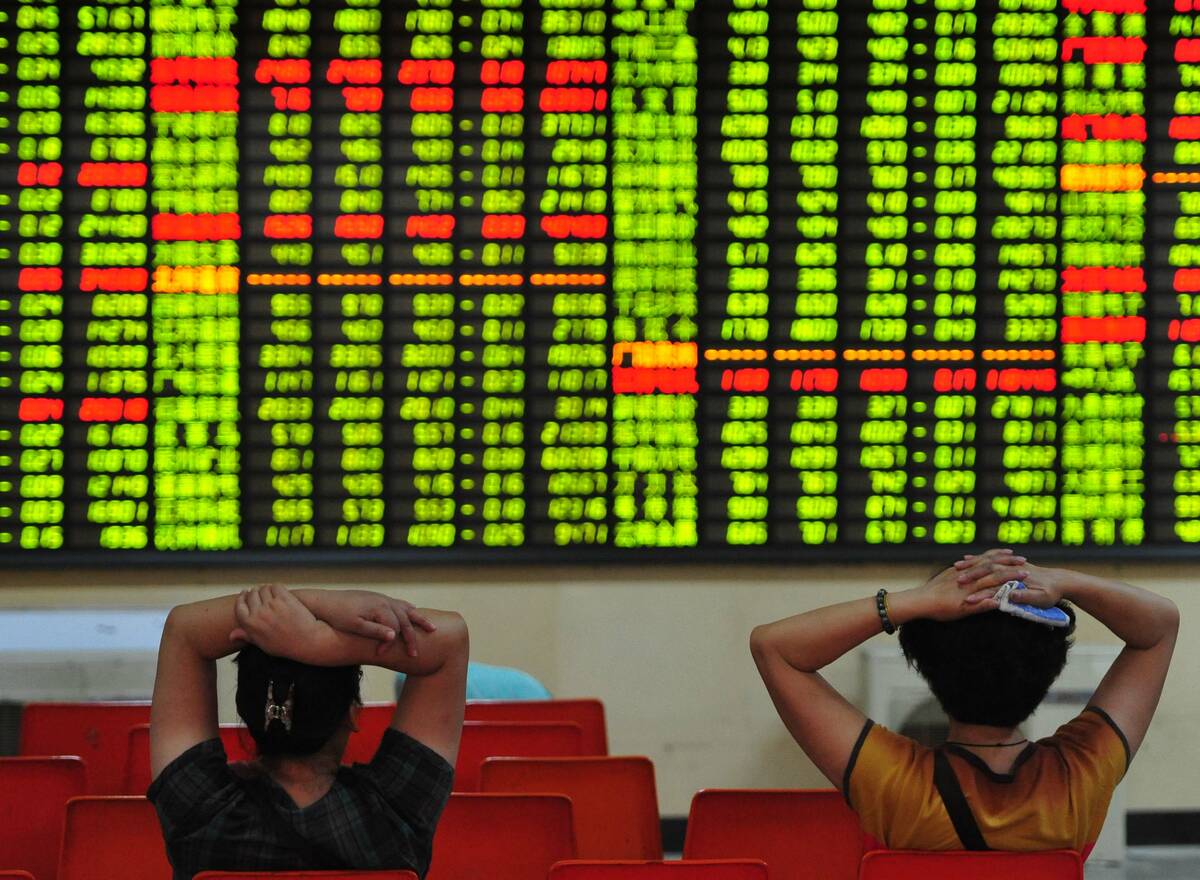 Concerned Chinese investors look at prices of shares (red for price rising and green for price falling) at a stock brokerage house in Jiujiang city, east Chinas Jiangxi province, 8 July 2013.
Chinese stocks tumbled on Monday (8 July 2013) on speculations that the resumed trading of Treasury bond futures and new share offerings will hurt stock prices. The Shanghai Composite Index dropped 48.93 points, or 2.44 percent, to 1,958.27 at the close.No Use China. No Use France.