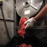 Butcher Brett Marley holds freshly ground beef at Casey's Market in Western Springs, Illinois, April 25, 2012.
